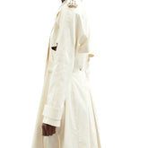 Spike studded anatomical cut out trench coat