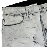 Crackled painted thigh zip denim