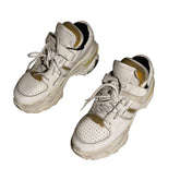 “Worn” look strap sneaker