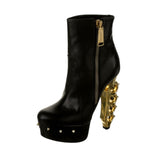 Runway brass knuckle bootie heel