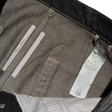 Flared waxed bronze denim