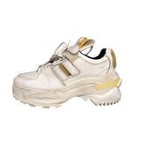 “Worn” look strap sneaker