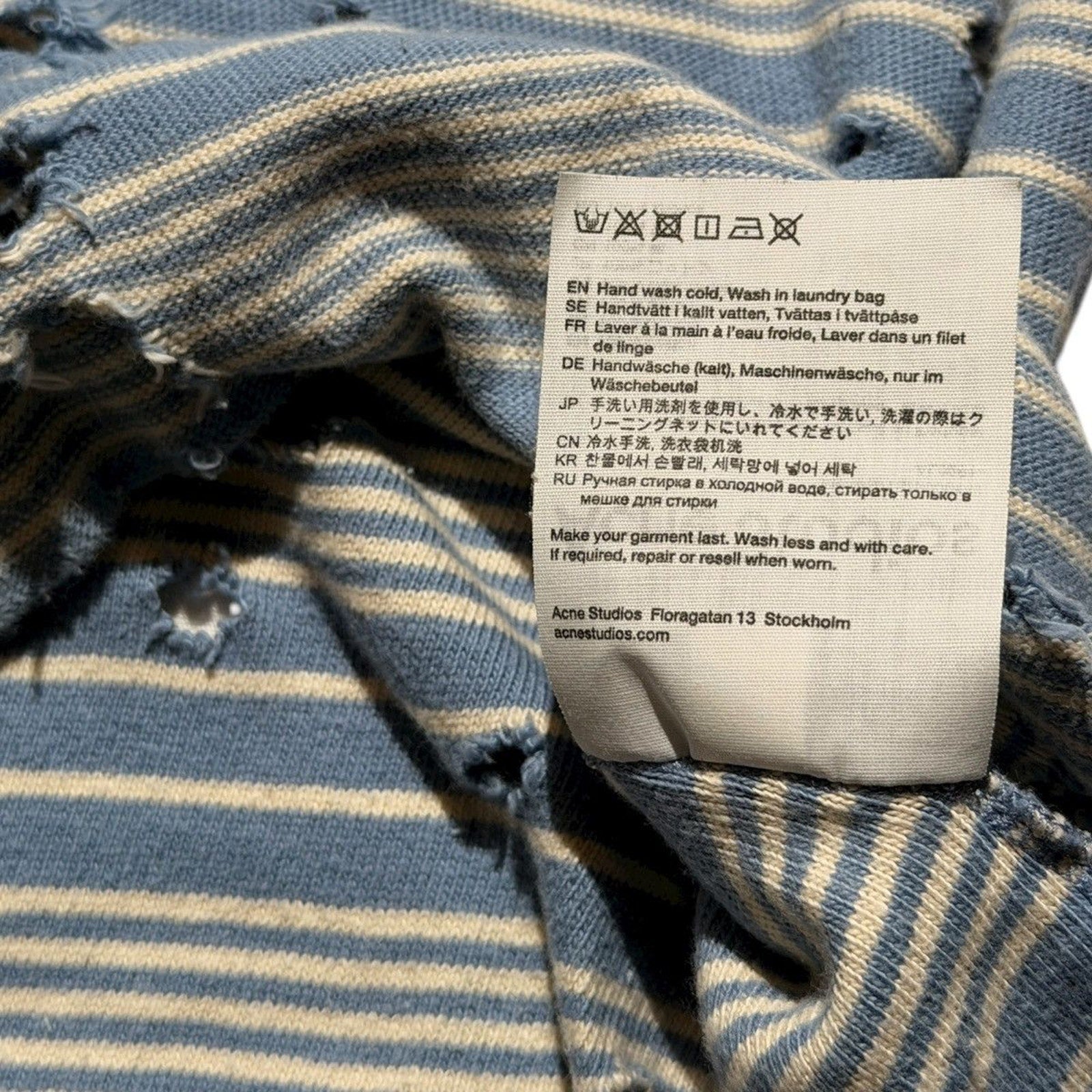 Distressed striped polo shirt