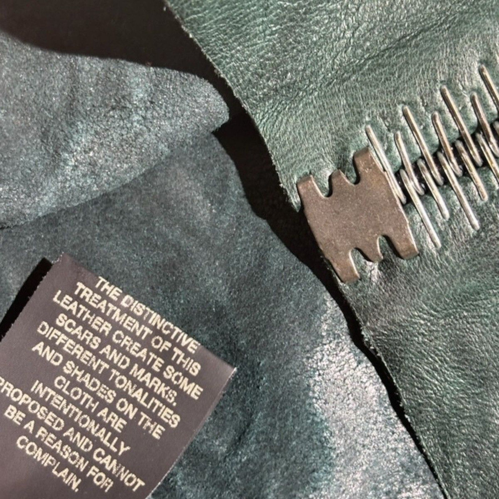 Bonded metal spine Humanoid staple seam leather jacket