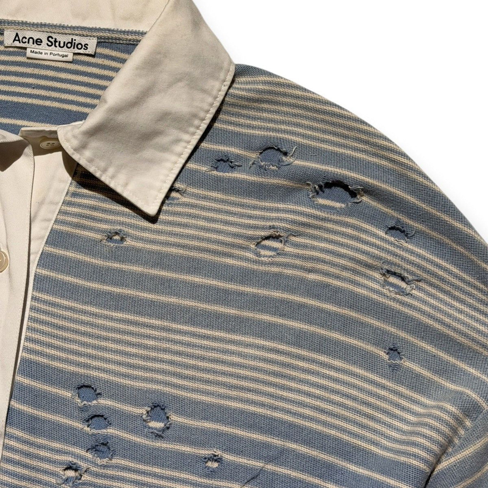 Distressed striped polo shirt