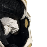 “Worn” look strap sneaker