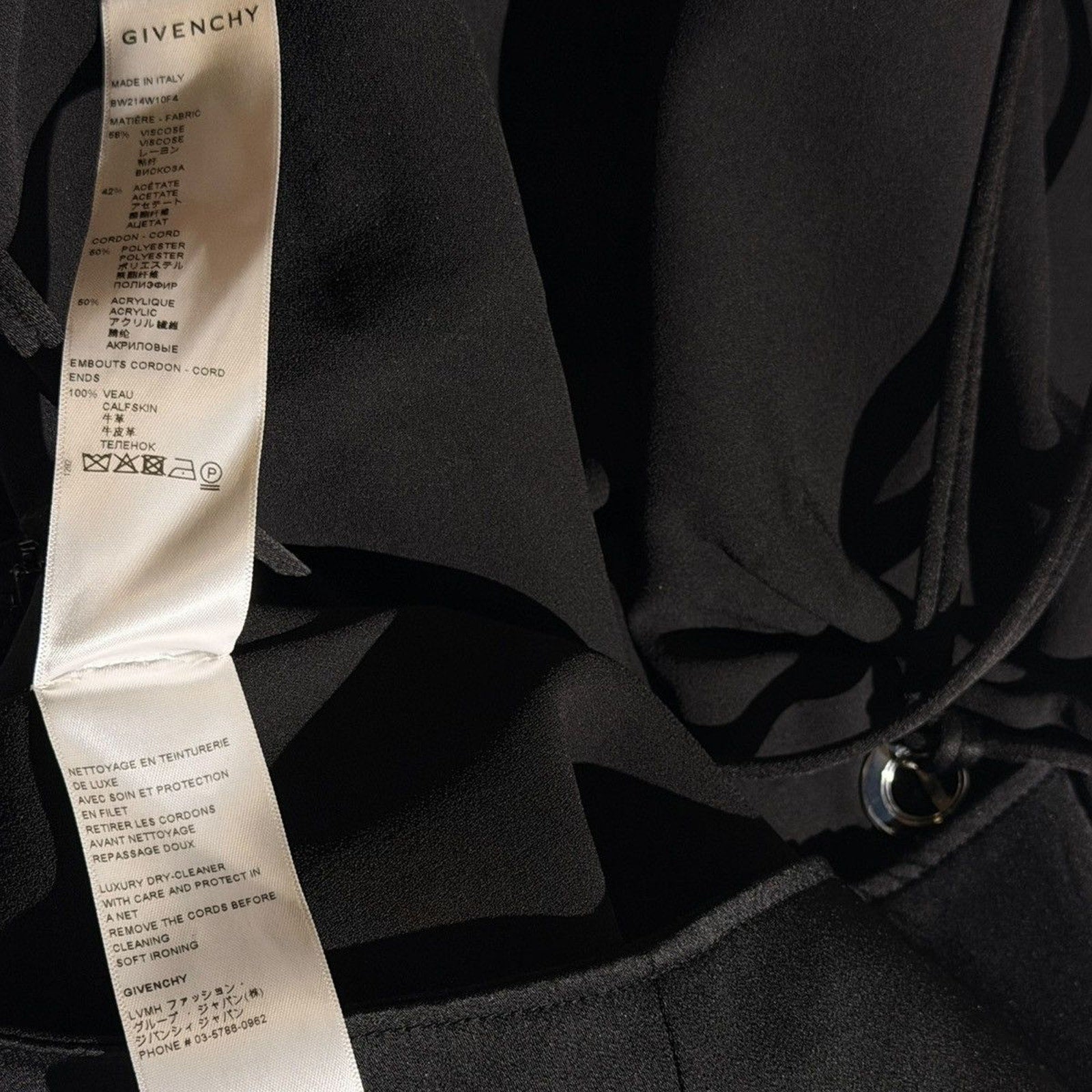 $2,590 asymmetric drape dress with G link chain