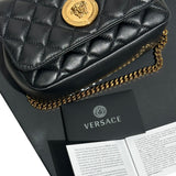 Quilted chain link medusa bag